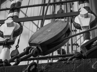 closeup of wooden block or pulley on traditional sailing vessel © flyingwalrus