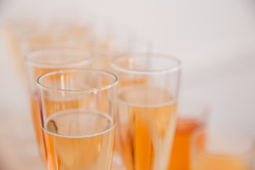 A number of glasses of champagne. Alcohol sparkles with bubbles in wine glasses