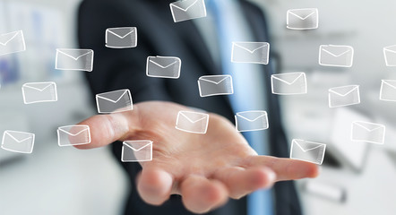 Businessman holding and touching floating emails sketch