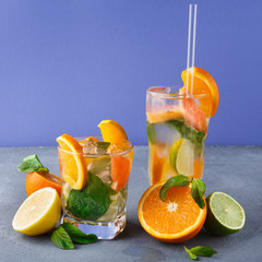 Colorful summer background with citrus drinks and fruits