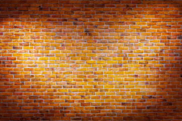 Fototapeta na wymiar Vintage brick wall background with spotlights on the wall