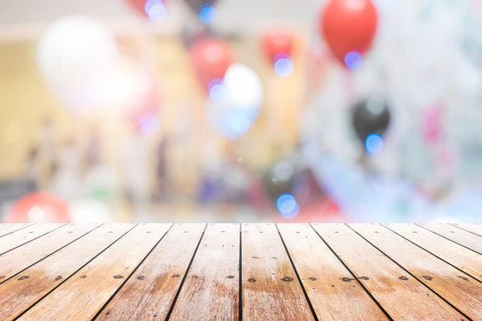 Empty Wooden Table With Party In Wedding Background Blurred.