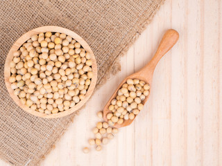 created shot of beans on wooden bowl in studio