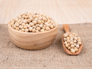 created shot of beans on wooden bowl in studio