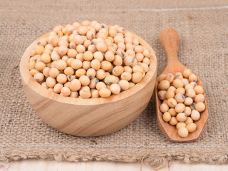 created shot of beans on wooden bowl in studio