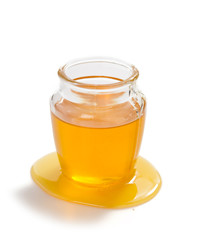 jar of honey on white background