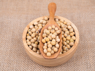created shot of beans on wooden bowl in studio
