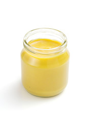 mustard sauce in jar on white