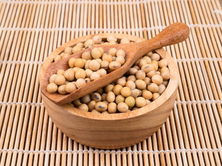 created shot of beans on wooden bowl in studio