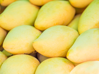 Fototapeta na wymiar ripe mangoes full of nutrition stacking for sale