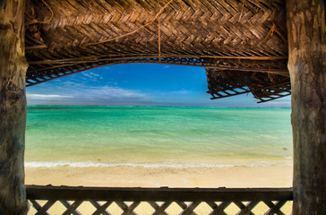 window from bungalow fale in samoa with a view to crystal blue ocean