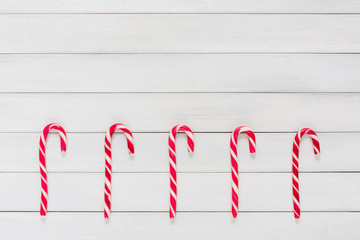 Christmas background with candies on wood