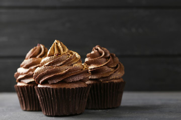 Chocolate cupcakes on grey wooden table