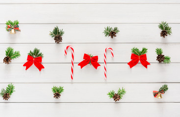 Christmas background with candies and small balls on wood