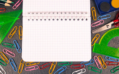 School supplies on black background ready for your design.