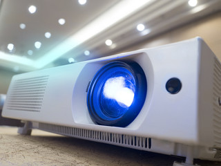 light shining through glass lens of LED projector to use in seminar