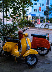 yellow and red bike, vespa retro motorcycle