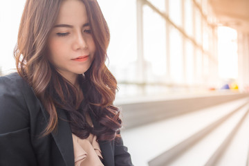 Fototapeta premium Beautiful Asia business woman over blue office background.