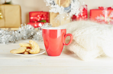 Red cup of coffee and coockies