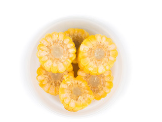 close up shot of steamed corn, sweet fruits on white background
