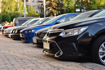 Cars parked on parking in row