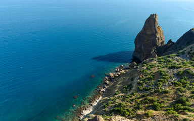 Fiolent Cape Crimea Black Sea. Blue azure seaside with corals sand and stones