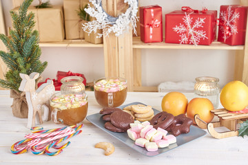 Christmas sweets on white wooden table