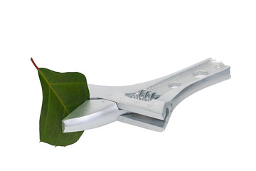 The green sheet is clamped with a wrench.