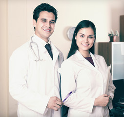 professional doctors smiling in clinic