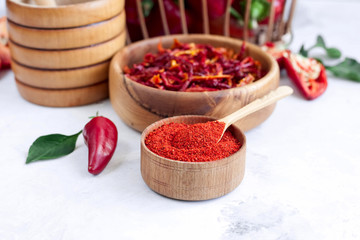 Homemade paprika spice on a spice background.