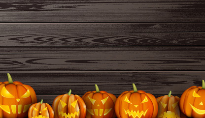 Wooden background with halloween pumpkins.