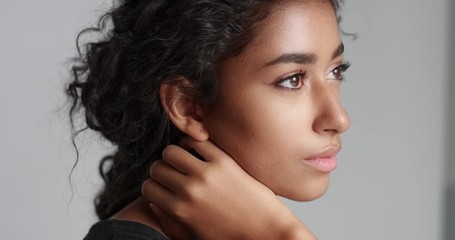 Portrait video of a gorgeous natural looking relaxed and happy Middle Eastern girl with beautiful olive skin