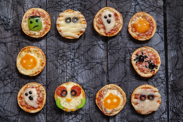 Mini pizzas decorated for a Halloween