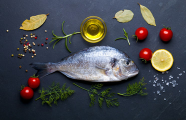 Fresh raw fish on a dark background