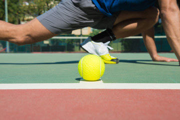 tennis player is stretching before the match
