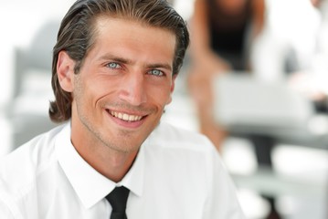 young businessman on background of office