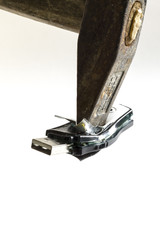from rage, with a hammer destroyed USB stick. isolated on white background