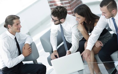 employees sitting in the lobby of the office.