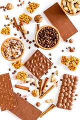 Ingredients for chocolates on white background top view