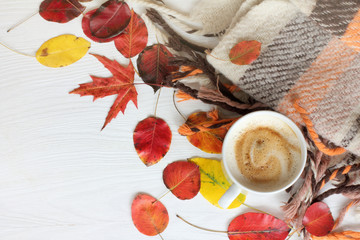 Naklejka na ściany i meble autumn coffee break/ flat layout with a cup of frothy cappuccino, leaves and a blanket top view