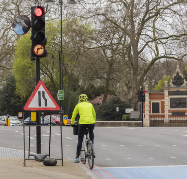 Cyclist At The Red Traffic Light In Chelsea, London, UK