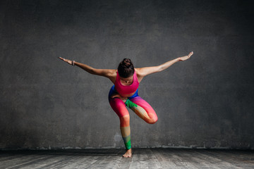 Fototapeta na wymiar Young beautiful yoga female posing in studio