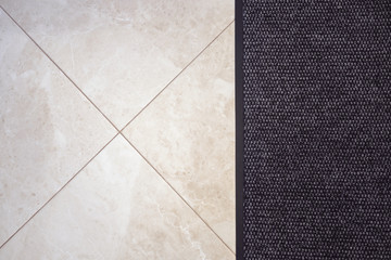 Fototapeta premium Floor carpet and beige marble tile