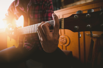 Fototapeta premium Man playing guitar on the style own.