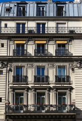 Fototapeta premium The traditional facade of Parisian building, France.