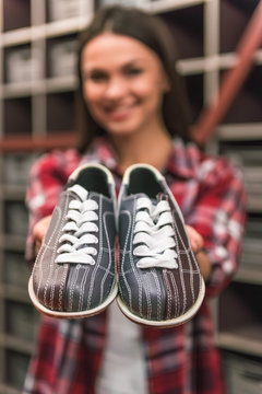 Girl with bowling shoes