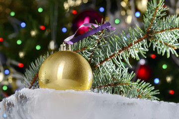Christmas still life on white snow, Christmas tree, fir cone and balls