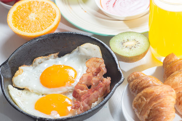 Nutritious breakfast, strawberry, bread, coffee orange juice, sausage, egg