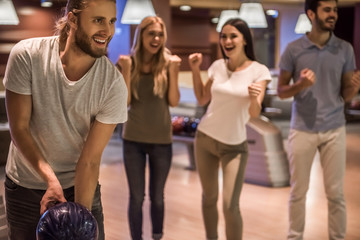 Friends playing bowling