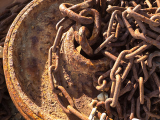 Rusty chain on marine capstan